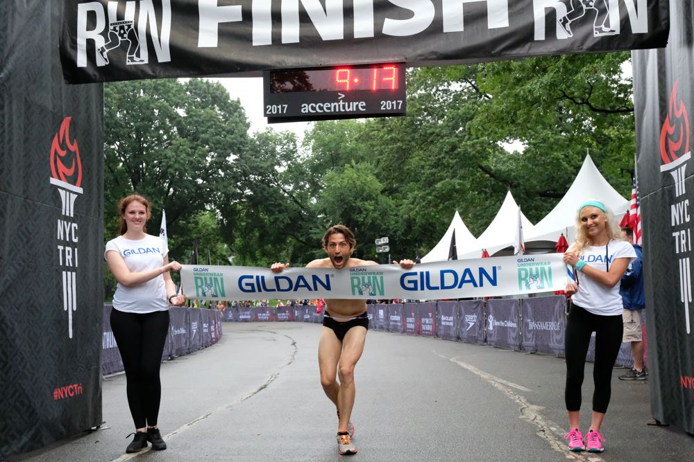 Benjamin Kiefer from the Upper West Side  crosses the finish line as the winner of the Gildan Underwear Run with a time of 9:13 (Tom Olesnevich for the NYC Triathlon)